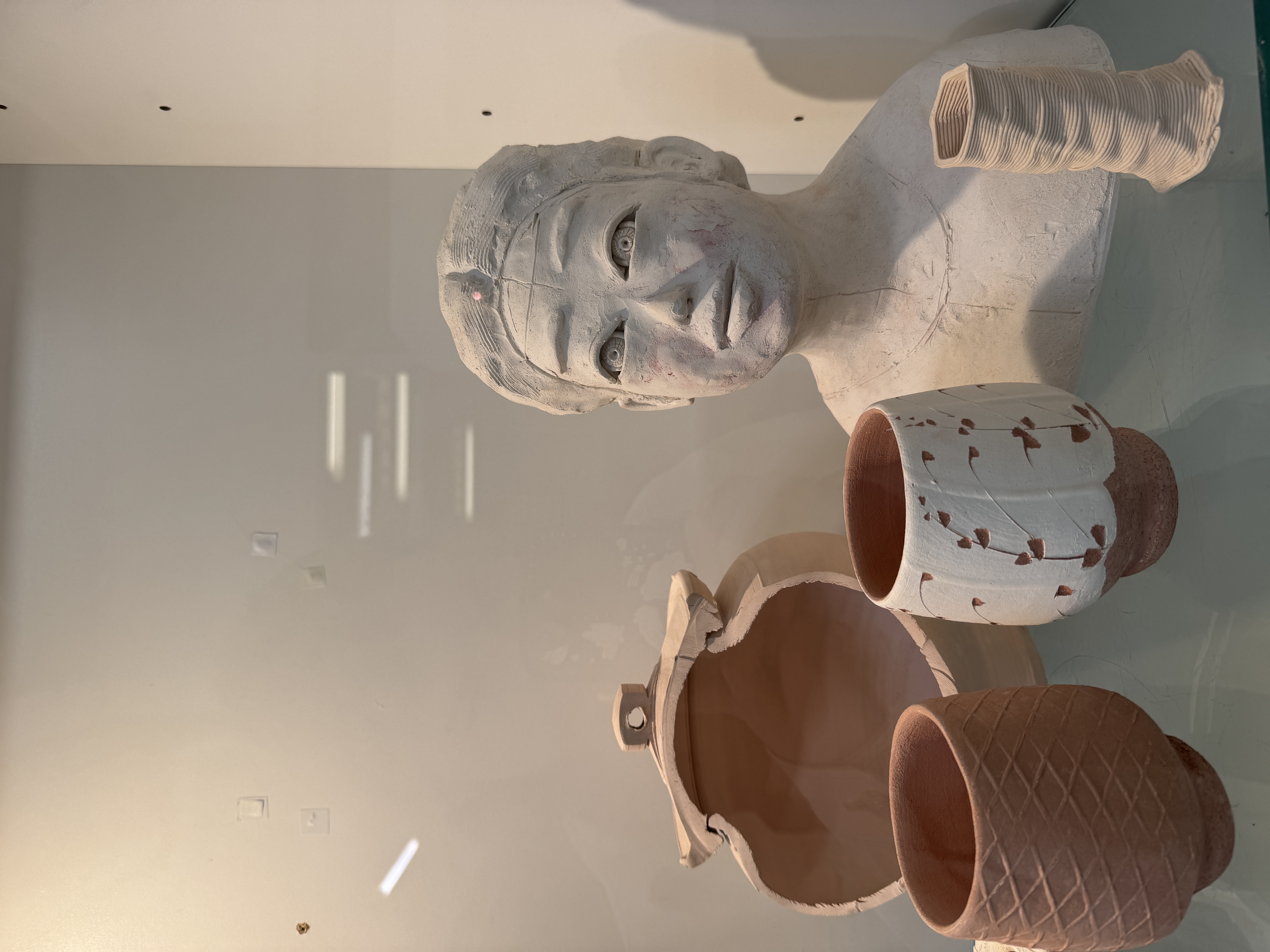 Image of clay faces and sculptures created by our Craft & Design ceramics studio