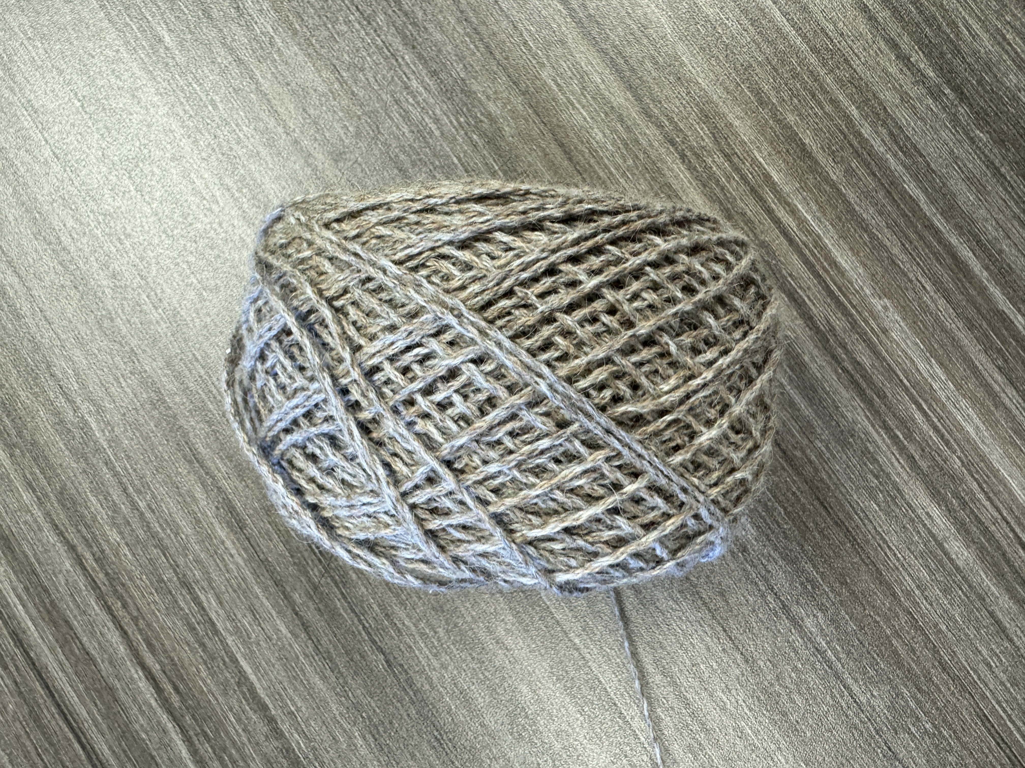 Image of a gray ball of yarn from our materials workshop 2