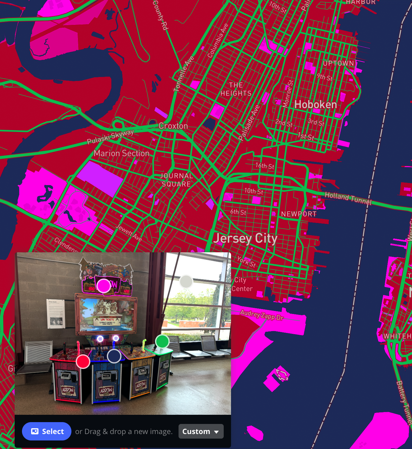 neon red, green, pink and purple map based on arcade game in S bulding at Sheridan